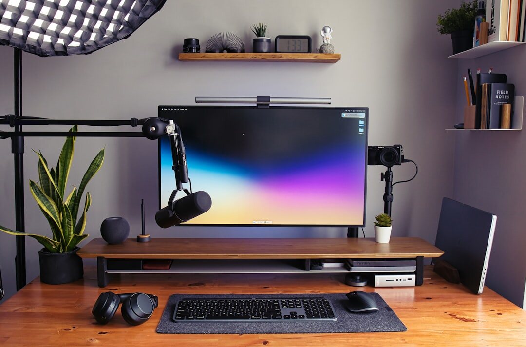 Small creative studio office with editing desks and mood board on the wall